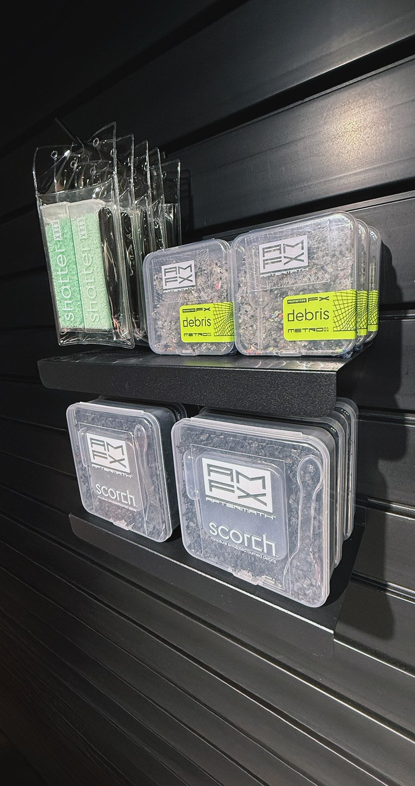 retailer_display wall display showing aftermathFX products (shatter, scorch, debris)